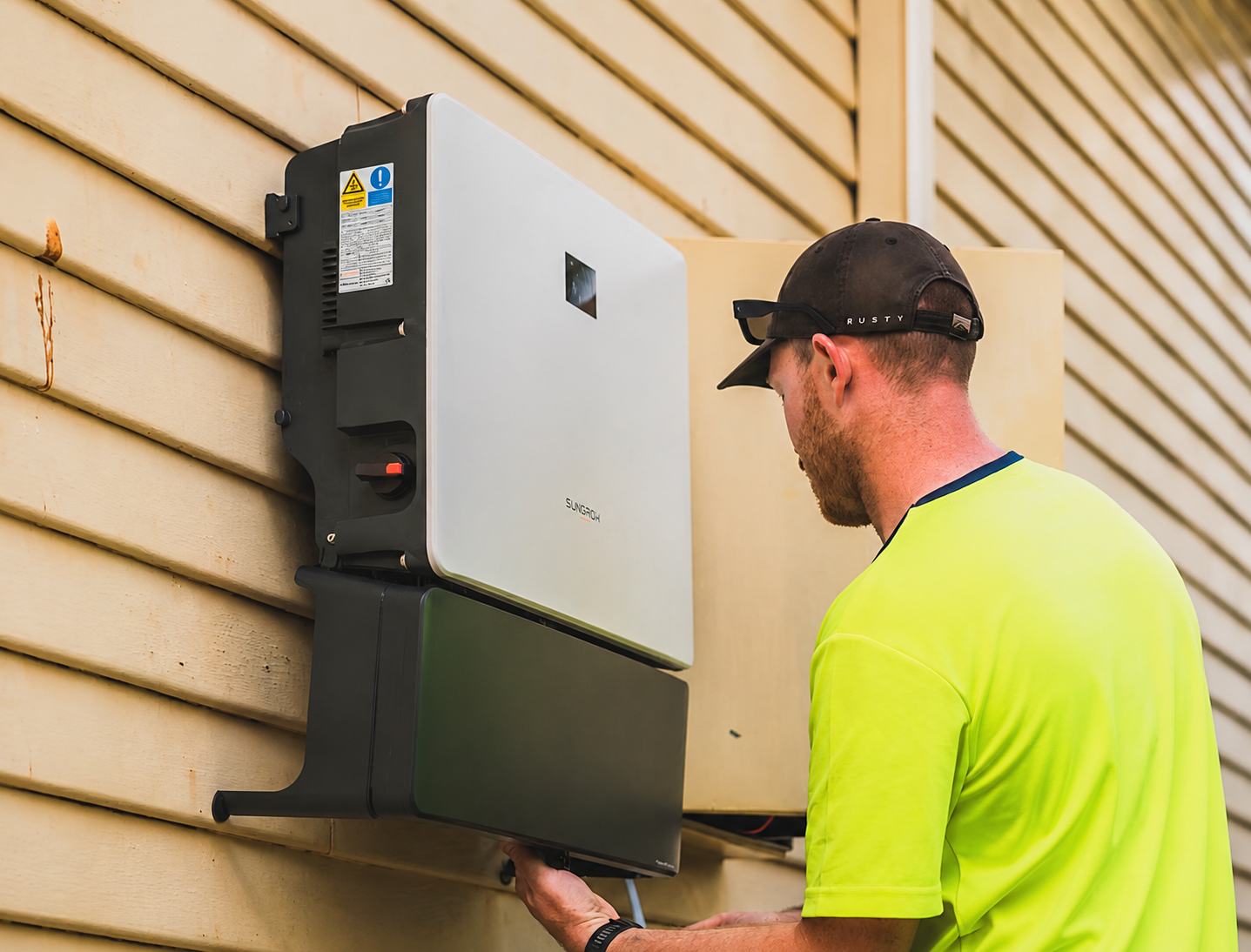 Technician working on power infrastructure equipment for substation coordination